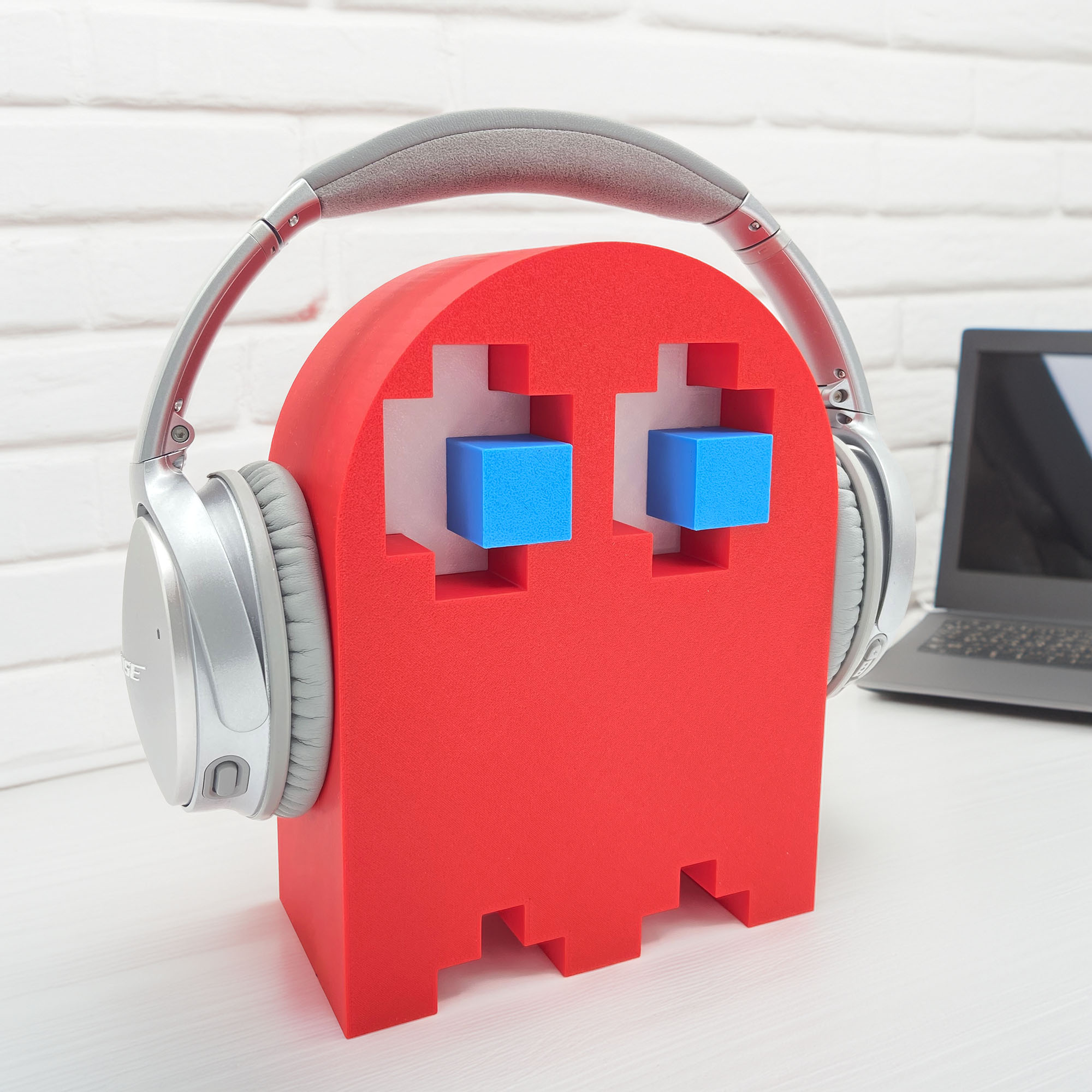 Blue eyes and red body ghost shaped headphone stand
