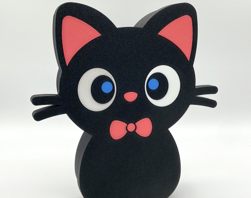 Front-facing view of a standing cute black cat box with a pink bow tie and big blue eyes.