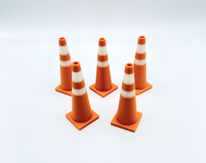 A set of five orange and white 3D printed traffic cones for RC drift tracks and toy dioramas.