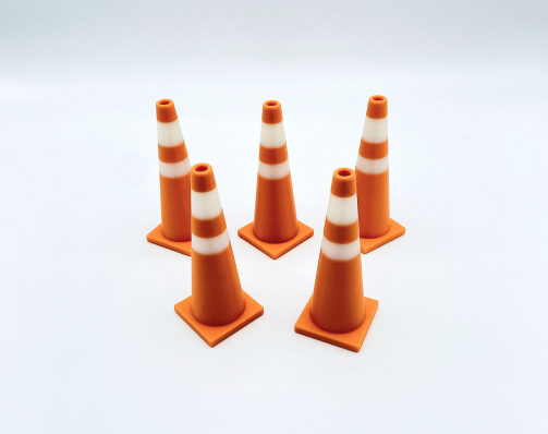 A set of five orange and white 3D printed traffic cones for RC drift tracks and toy dioramas.