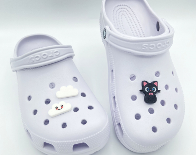 Collection of Kawaii 3D printed charms featuring cats and clouds on clogs.
