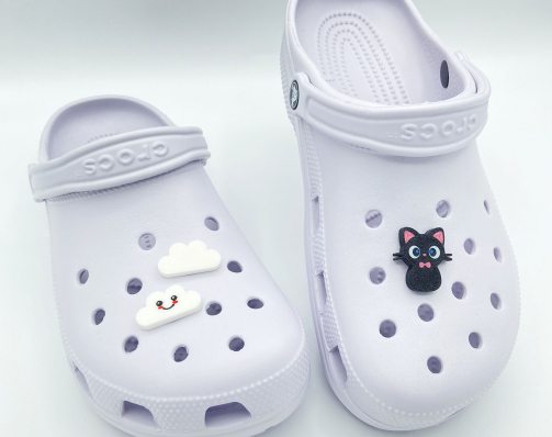 Collection of Kawaii 3D printed charms featuring cats and clouds on clogs.