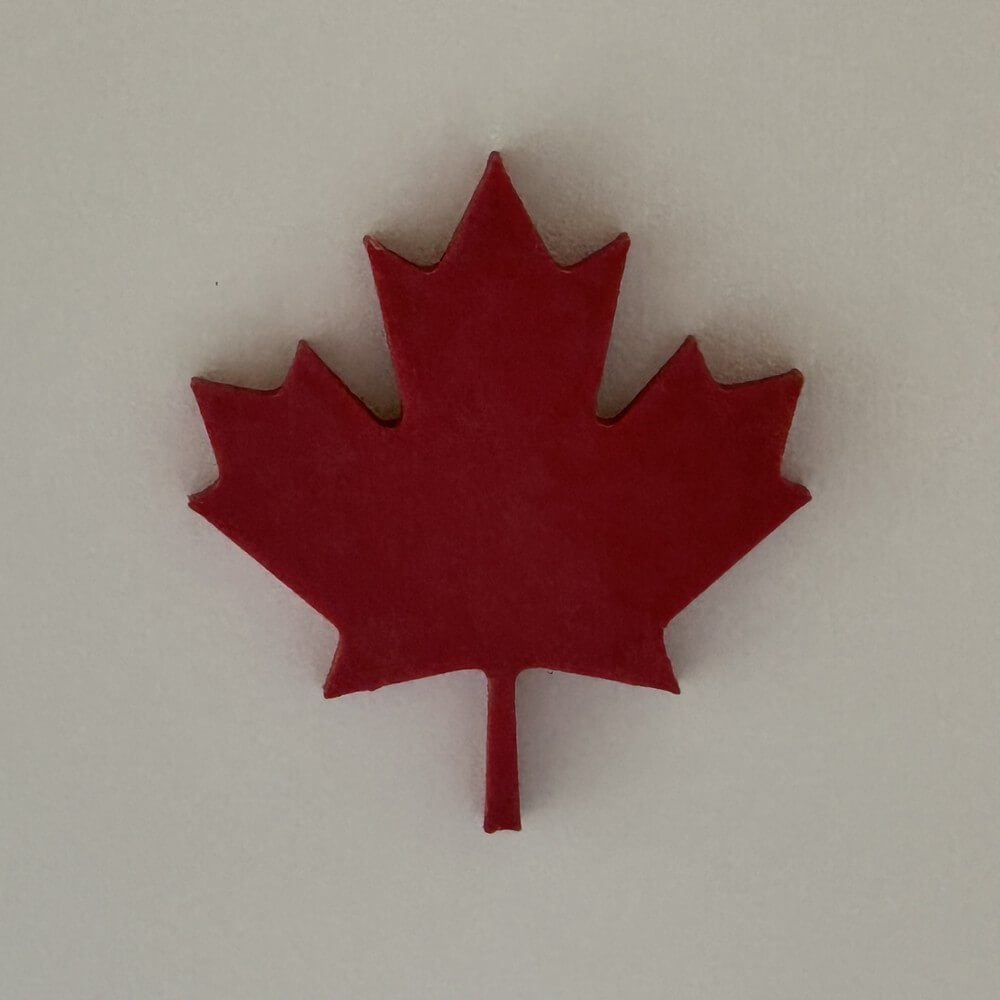 3D printed Canadian Maple Leaf magnet inspired by the official Canadian flag, made in Canada and available as a magnet, shoe charm, or keychain.